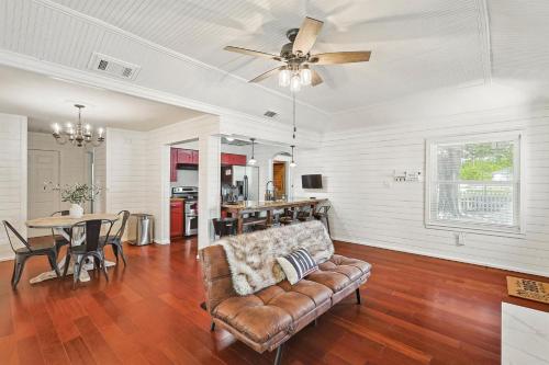 a living room with a couch and a table at 3BD Farmhouse Country Living - Pool Patio Firepit in McKinney