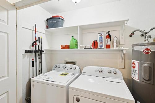 a kitchen with a stove and a refrigerator at 3BD Farmhouse Country Living - Pool Patio Firepit in McKinney