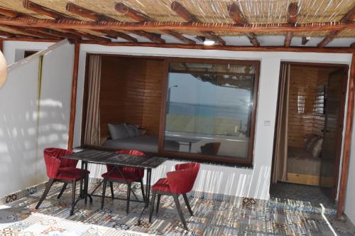 Балкон или терраса в KABANO BEACH AUBERGE CAFE RESTAURANT
