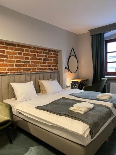 Postel nebo postele na pokoji v ubytování Arte-locum Apartamenty przy Rynku