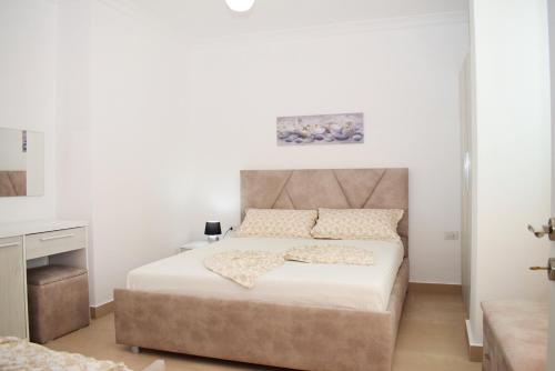 a bedroom with a large bed and a desk at Best Summer Apartment in Golem