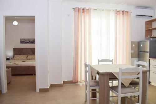 a kitchen and dining room with a table and chairs at Best Summer Apartment in Golem
