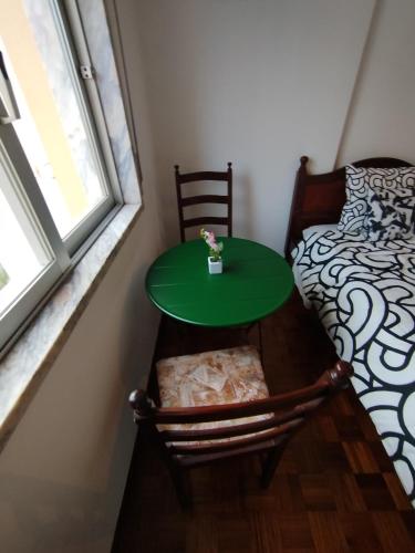 Ένα ή περισσότερα κρεβάτια σε δωμάτιο στο Room place to stay in Lisbon