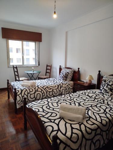 Ένα ή περισσότερα κρεβάτια σε δωμάτιο στο Room place to stay in Lisbon