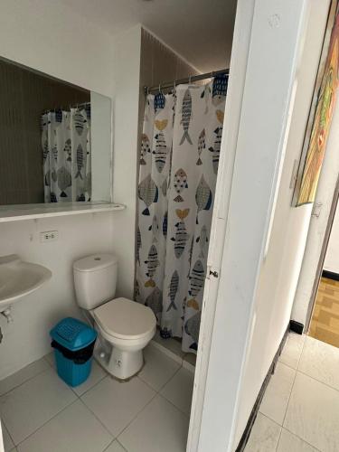 a bathroom with a toilet and a sink at Apto707Posihueica con la mejor vista a la Bahia de Santa Marta in Santa Marta