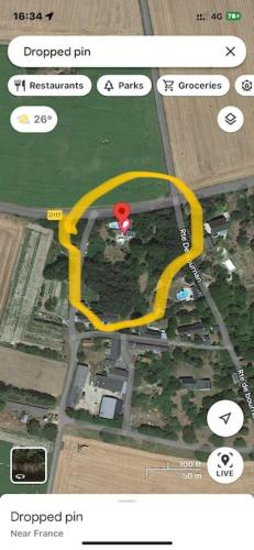 a map of a parking lot with a red spot at Villa Maison Roberto in Lerné