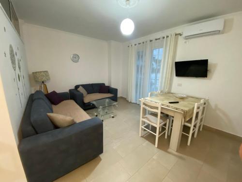 a living room with a couch and a table at Best Summer Apartment in Golem