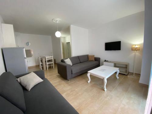 a living room with a couch and a table at Best Summer Apartment in Golem