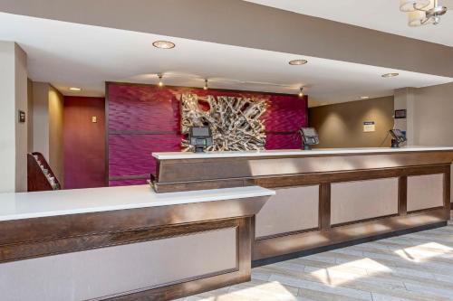 a lobby of a hotel with a reception desk at Best Western Plus Kingston Hotel and Conference Center in Kingston