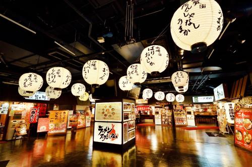 a store with many clocks hanging from the ceiling at HOTEL FORZA HAKATAEKI CHIKUSHI-GUCHI Ⅰ in Fukuoka
