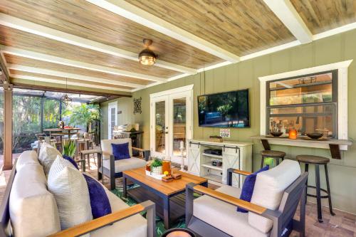 a living room with a couch and a table at Port St Lucie Retreat Lanai with Private Pool! in Port Saint Lucie
