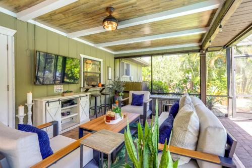 a living room with a couch and a table at Port St Lucie Retreat Lanai with Private Pool! in Port Saint Lucie