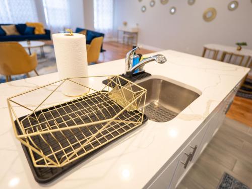 a kitchen counter with a sink and a counter top at 4 New Apts - 3 Bed Apt 1st Floor & 3 Bed Apt 2nd Floor - 1 Bed Studio Apt Ground Floor & 1 Bed Studio Apt Ground Floor near Penn Station EWR Airport Beth Israel Hospital NYC in East Orange