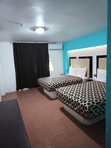 Кровать или кровати в номере Hotel Essen's