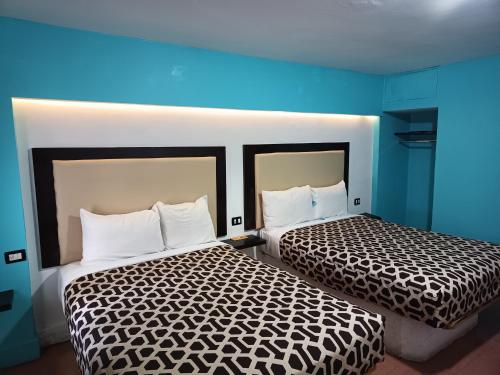 Кровать или кровати в номере Hotel Essen's