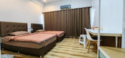 สิริธิราเพลส Sirithira Placeにあるベッド