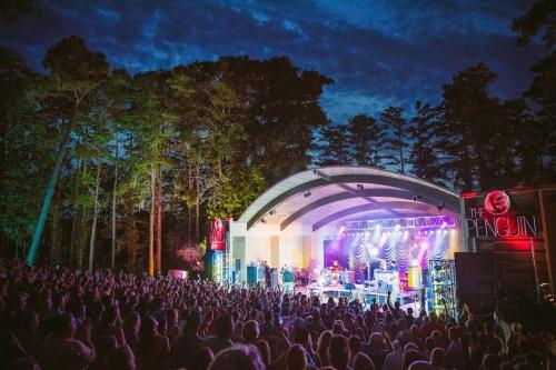 a crowd of people in front of a stage at night at Half Off Prices! 2 Miles to Downtown Front Street! Free Parking! in Wilmington