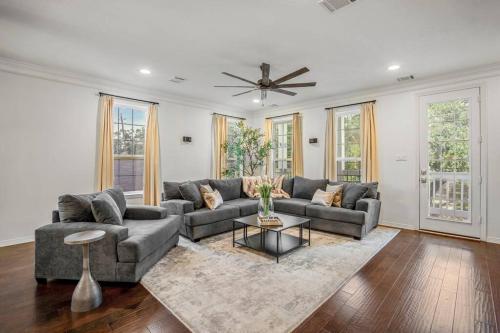 a living room with a couch and a table at Vintage Hollywood Theater House in East Downtown in Houston