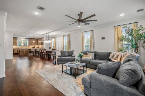 a living room with a couch and a table at Vintage Hollywood Theater House in East Downtown in Houston