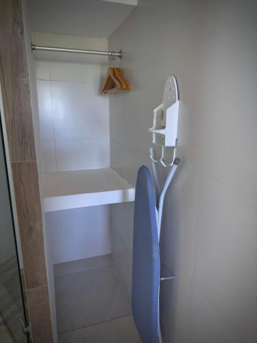 a walk in shower with a phone on the wall at Hotel Maioris Kumate Culiacán in Culiacán