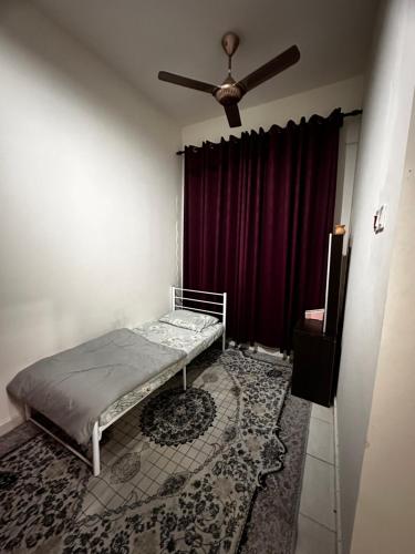 Ένα ή περισσότερα κρεβάτια σε δωμάτιο στο T-DO Homestay,Taman Bertam Impian,Melaka