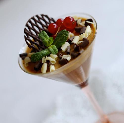 a dessert in a cup on top of a spoon at Altavilla Locanda E Tipica Trattoria in Bianzone