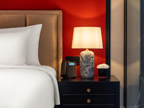 Ένα ή περισσότερα κρεβάτια σε δωμάτιο στο T Boutique Hotel