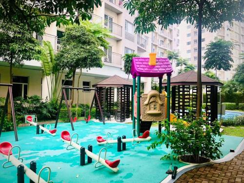 a playground in front of a building at 2br condo in Southmall Las Pinas 25 mins to NAIA - 709T3 in Manila