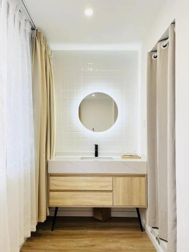 a bathroom with a sink and a mirror at WillsChengduCenter in Chengdu