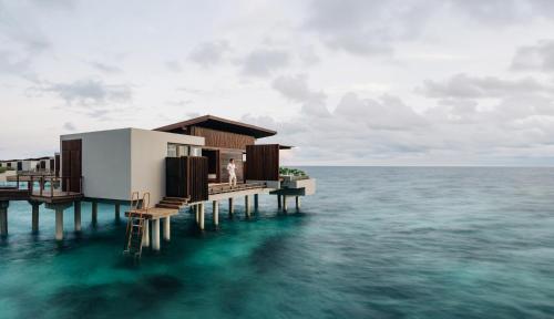 a house on a pier in the water at Park Hyatt Maldives Hadahaa in Gaafu Alifu Atoll