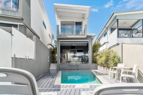an image of a house with a swimming pool at Ray of Sunshine in Gold Coast