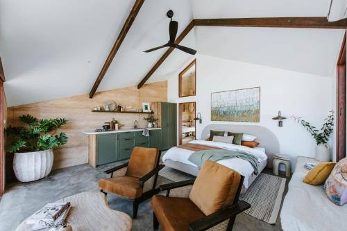 a bedroom with a bed and a sink in a room at Oak Studio at Kavillo in Mudgee