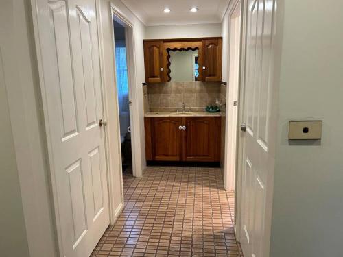 a small bathroom with a sink and a mirror at Luxury House 5 bedrooms in Windsor