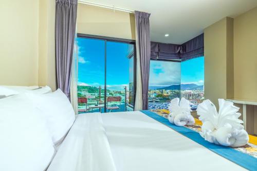 Katil atau katil-katil dalam bilik di Kana Triple L Hotel Phuket普吉岛卡娜3L酒店