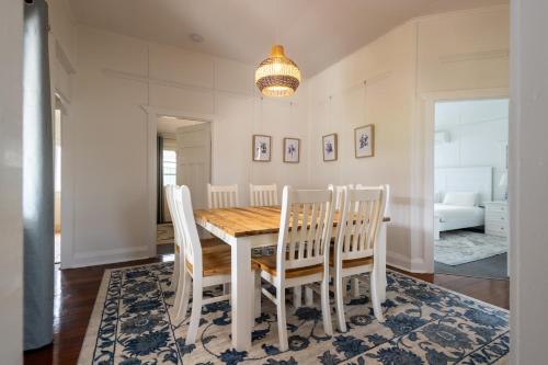 a dining room with a table and chairs at Bay Vista Cottage by the BnB Collection in Albany