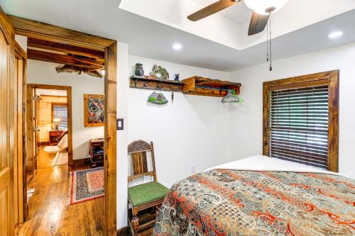 a bedroom with a bed and a ceiling fan at Dreamy Damascus Cabin about 1 Mi to Appalachian Trail in Damascus