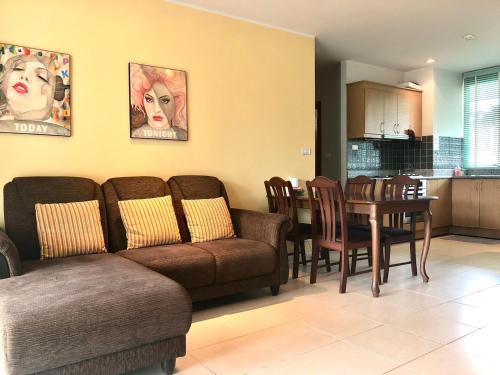 a living room with a couch and a table at Seaview Condominium A12 in Ban Tha Fat