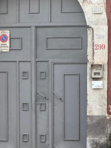 a large metal door with an arch in a building at Il campanile in Scafati
