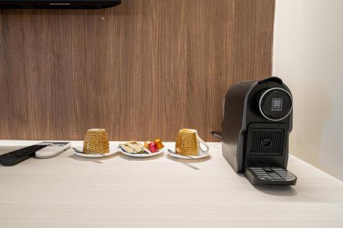 a black printer sitting on top of a table at Athithara Homestay in Phra Nakhon Si Ayutthaya
