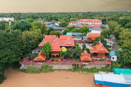 an aerial view of a house with red roofs at Athithara Homestay in Phra Nakhon Si Ayutthaya