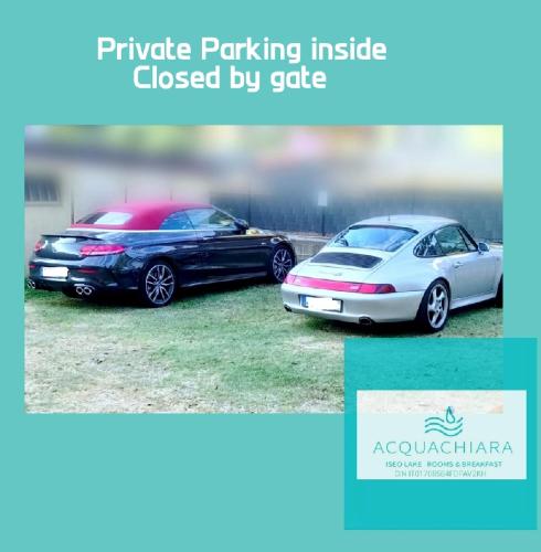 two cars parked next to each other at ACQUACHIARA ISEO CENTER BED AND BREAKFAST villa with PARKING inside Foresteria in Iseo