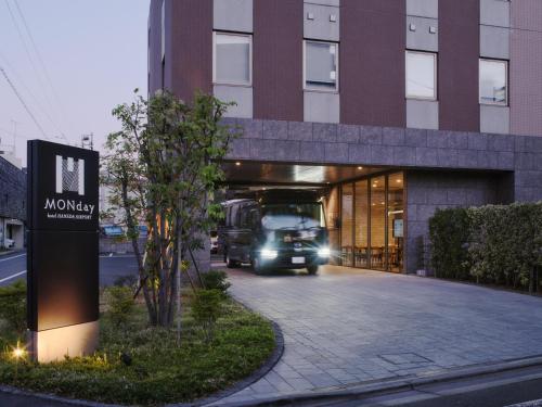a truck is coming out of a building at hotel MONday Haneda Airport in Tokyo