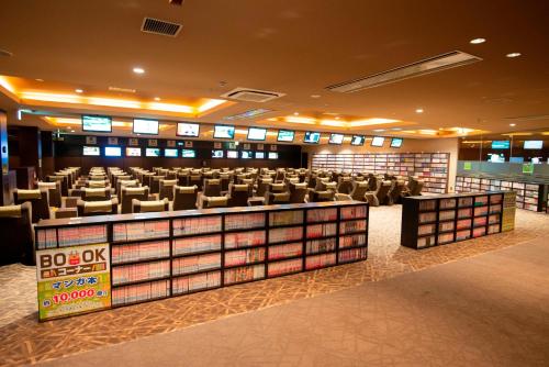 a library with rows of chairs and desks in it at Nara Plaza Hotel in Tenri