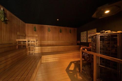 a large empty room with wooden floors and wooden walls at Nara Plaza Hotel in Tenri