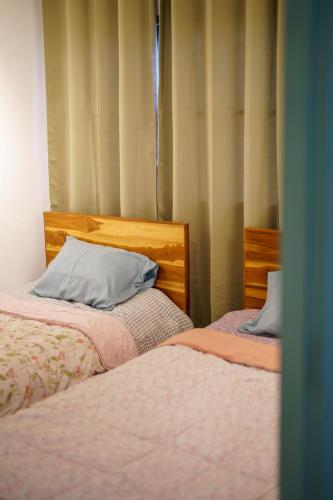 Ein Bett oder Betten in einem Zimmer der Unterkunft Ta Kaew Hostel ตาแก้ว โฮสเทล