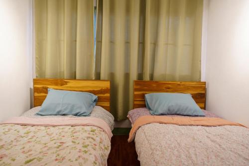 Ein Bett oder Betten in einem Zimmer der Unterkunft Ta Kaew Hostel ตาแก้ว โฮสเทล