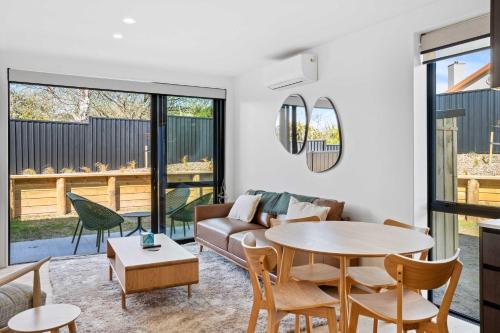 a living room with a couch and a table at Mt Roy Delight in Wanaka