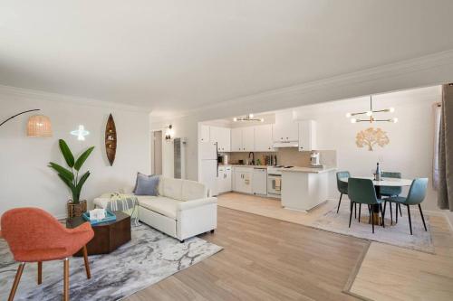 a living room with a couch and a table with chairs at Charming 2BR Coastal Getaway in Pacifica in Pacifica