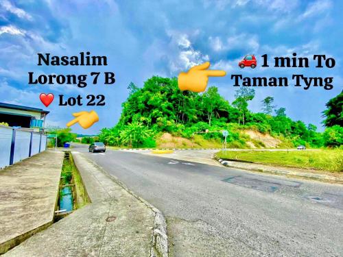 a picture of a road with the words kasaki long and the words at Entire home hosted by Catherine 4 bedroom House in Sandakan