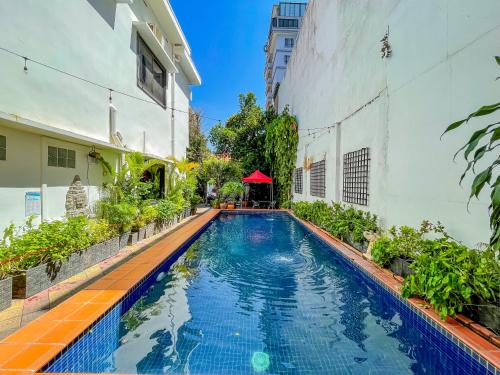 a swimming pool in the middle of a building at Birdcage Boutique in Phnom Penh